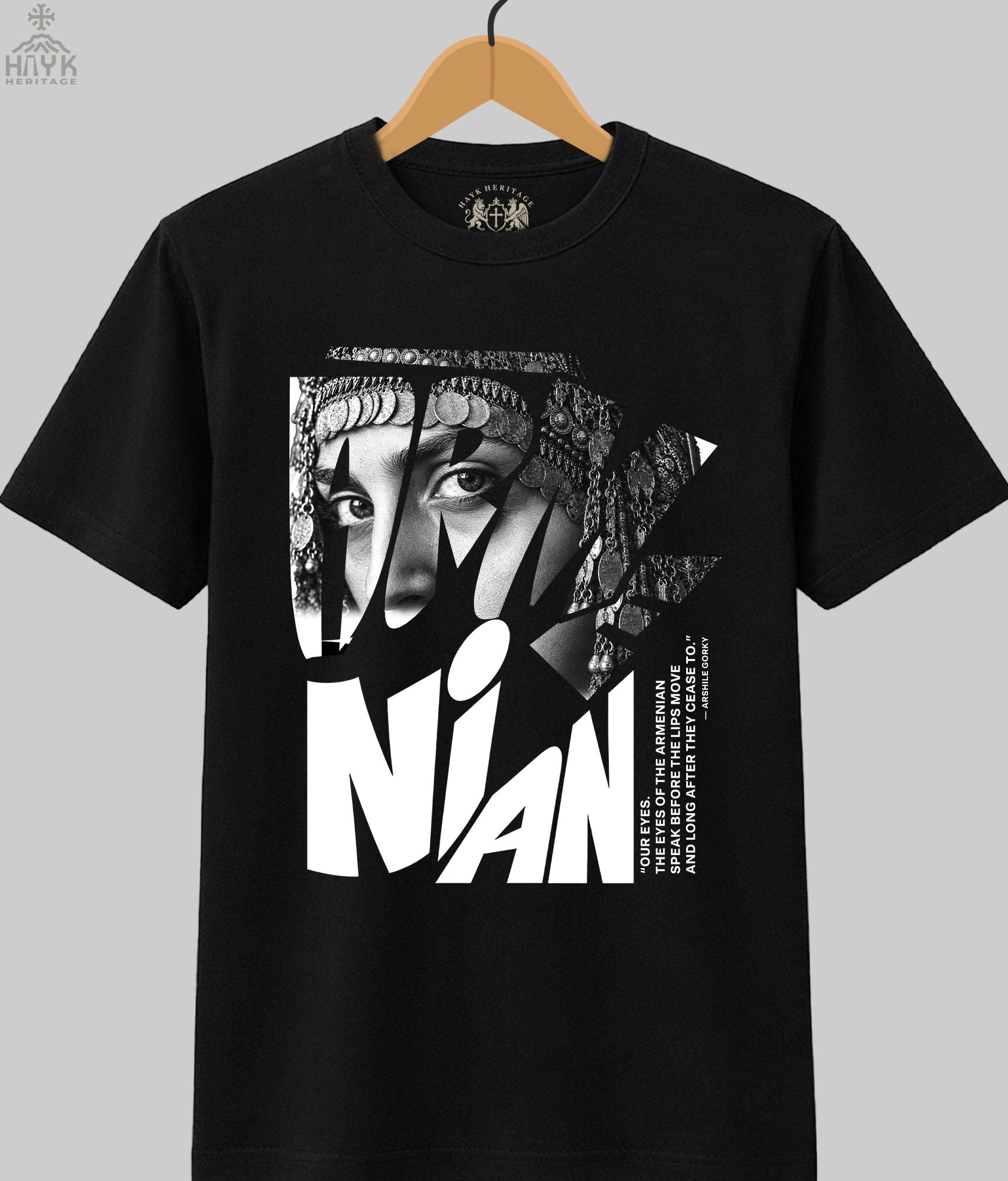 Armenian Eyes Arshile Gorky tribute t-shirt — woman in traditional coin headdress with ARMENIAN typography framing her eyes, black and white